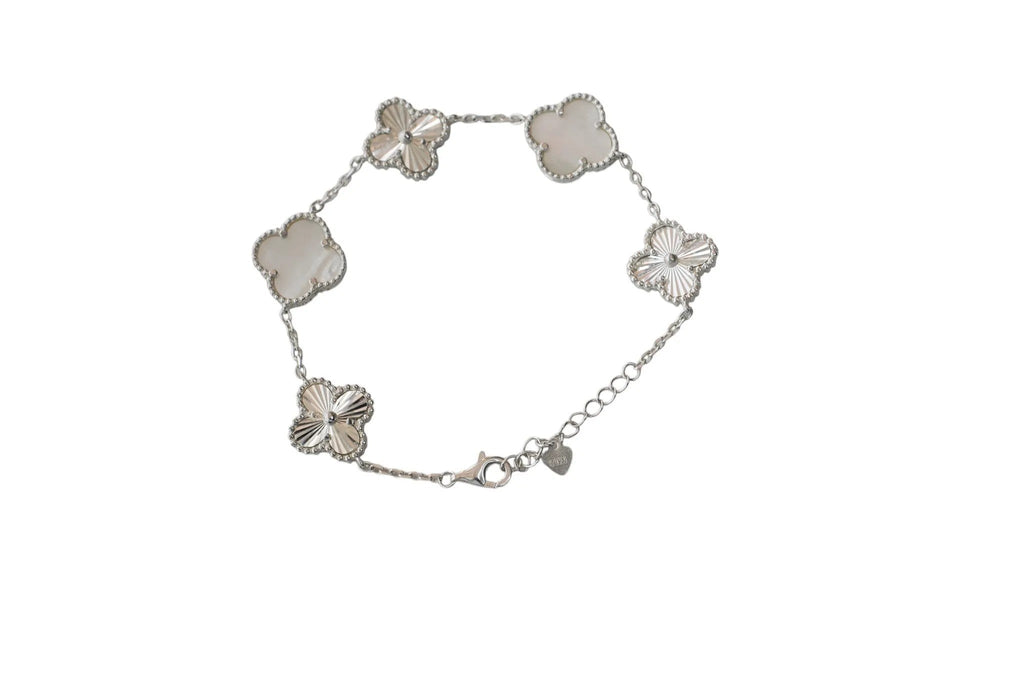 Hally Jewelry sterling silver bracelet with five mother-of-pearl clover charms and adjustable chain.